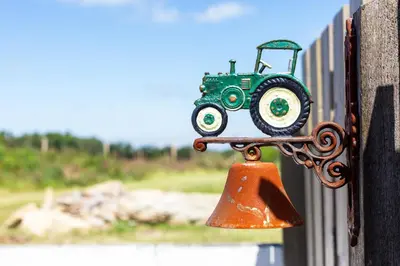 a toy train attached to a fence with a bell at The Tractor Shed, a romantic barn retreat on the edge of Falmouth in Budock Water