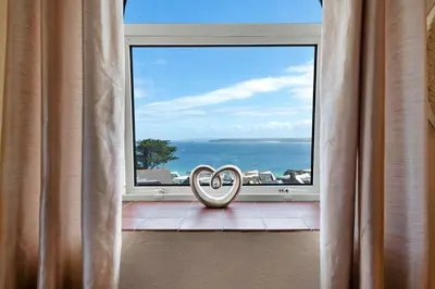 a couple of rings sitting in front of a window at Finest Retreats - No 11 Porthminster in St Ives