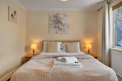 a bedroom with a bed with towels on it at Finest Retreats - Number 10 Porthmeor in St Ives