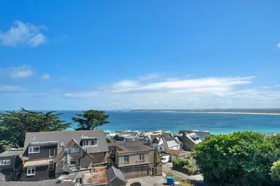 an aerial view of houses and the ocean at Finest Retreats - Number 10 Porthmeor in St Ives