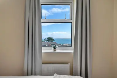 a window with a view of the ocean at Finest Retreats - Number 10 Porthmeor in St Ives