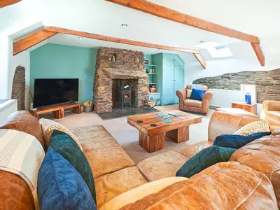 a living room with a couch and a fireplace at 3 Bed in St. Ervan oc-t29660 in Little Petherick