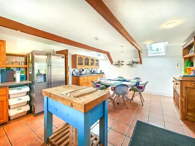 a kitchen with a table and a dining room at 3 Bed in St. Ervan oc-t29660 in Little Petherick