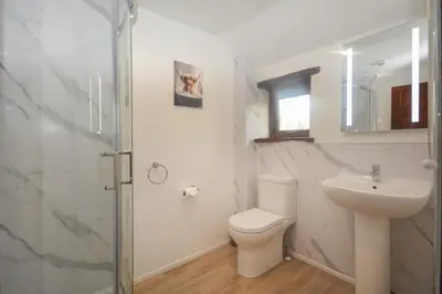 a bathroom with a toilet and a sink and a shower at 2 Bed in St. Merryn oc-w29716 in St Merryn
