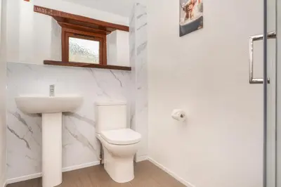 a bathroom with a toilet and a sink at 2 Bed in Padstow oc-w3658 in St Merryn