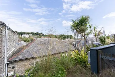 a roof of an old building with a palm tree at Prospect House in Padstow
