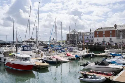 a bunch of boats are docked in a harbor at Prospect House in Padstow