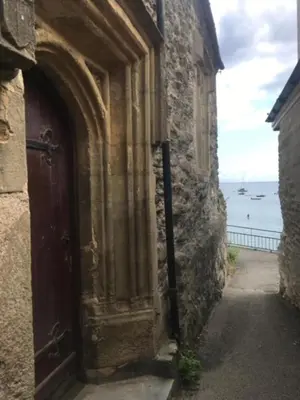 an entrance to a stone building with a door at Seaforth - Fisherman's Cottage in Gorran Haven