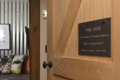 a sign on the door of a room at The Old Dairy in Camborne