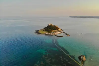 an island in the water with a castle on it at The Old Dairy in Camborne