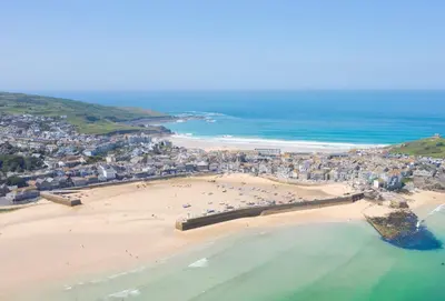 an aerial view of a beach and the ocean at The Hay Loft in Camborne