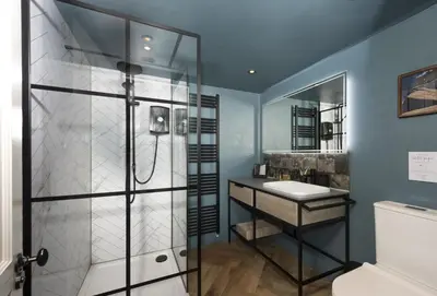 a bathroom with a shower and a sink at The Corner Cottage in Camborne