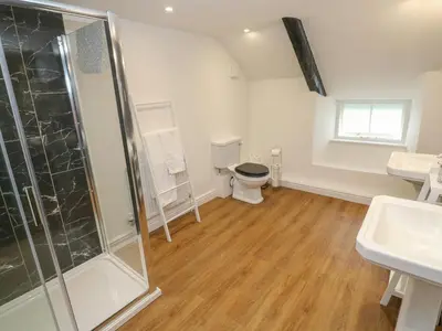 a bathroom with a shower and a toilet at The Old Post Office in Camborne