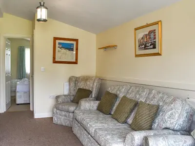 a living room with a couch and two chairs at Cat's Cove - Uk47720 in St Merryn