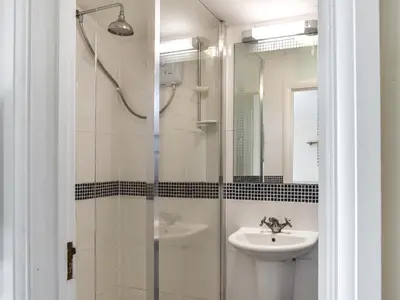 a bathroom with a sink and a shower at Cat's Cove - Uk47720 in St Merryn
