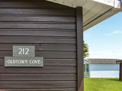 a sign on the side of a house with a window cove at Old Town Cove - Uk47724 in St Merryn