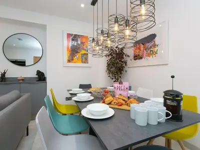 a dining room with a table with fruit on it at Avon Cottage in St Ives