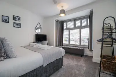 a hotel room with a bed and a window at 119 Henver Road in Newquay