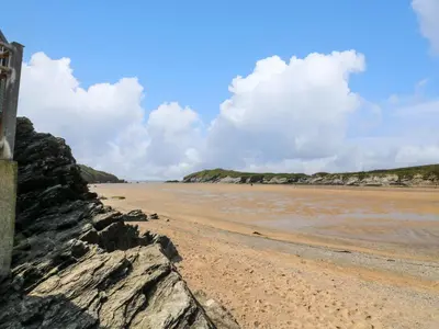 a view of a beach with rocks on the shore at 119 Henver Road in Newquay