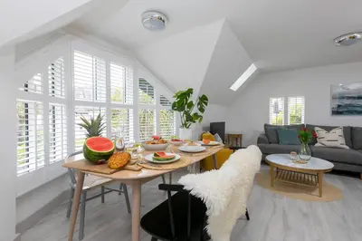 a living room with a table with fruit on it at Westholme in St Ives