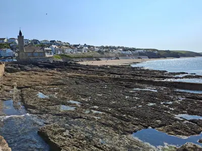 a view of a beach with houses and the ocean at Loe Bar Top in Porthleven