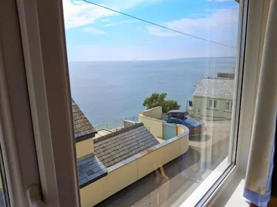 a view of the ocean from a window at Loe Bar Top in Porthleven