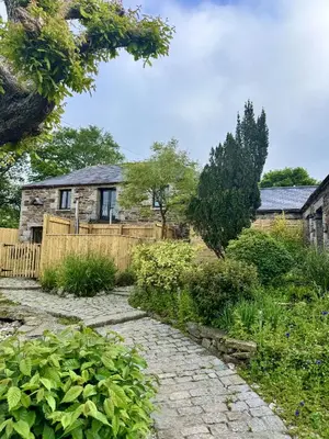 a stone path in front of a house at Nuthatch by Together Travel - Luxury Cornish Countryside Retreat in Bodmin