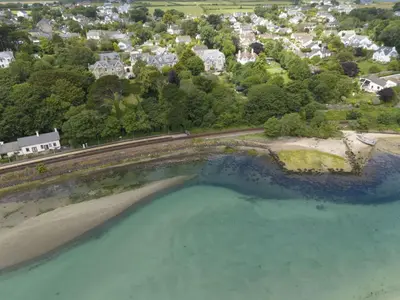 an aerial view of a beach and the ocean at The Elms in Uny Lelant
