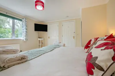 a bedroom with a large white bed in a room at 4 Bed in Newquay oc-b29882 in Newquay