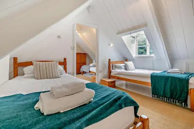a bedroom with two beds in a attic at 5 Bed in Padstow oc-s29853 in Padstow