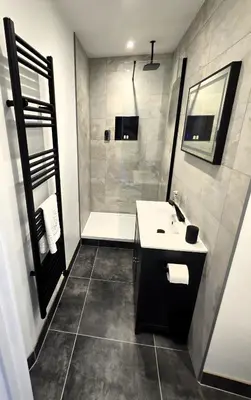 a bathroom with a sink and a bath tub at Premier 4 - Stunning Suite, beautiful sea views in St Ives