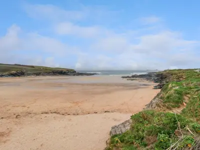 a sandy beach with the ocean in the background at Constantine Bay in Padstow