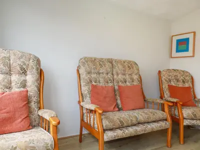 two chairs and a couch in a room at Constantine Bay in Padstow
