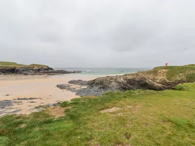 a beach with the ocean in the background at Newtrain Bay in Padstow
