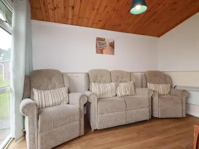 two chairs and a couch in a living room at Hawker's Cove in Padstow