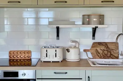 a kitchen with a counter with appliances on it at Willow Lodge in Helston