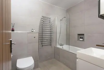 a bathroom with a toilet and a sink and a shower at Hob Nob in Liskeard