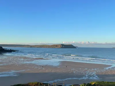 a view of the beach and the ocean at Atlantic View, North Cornwall seafront, 5* Gold in Polzeath