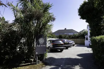 a parking lot with cars parked in a driveway at Another Nook in St Ives