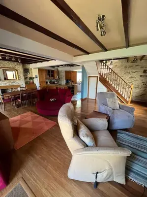 a living room with a white couch and chairs at Open Plan 3 Bedrooms Cornish stone house cottage in St Austell