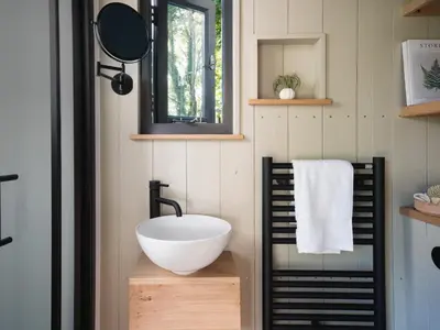 a bathroom with a bowl sink and a mirror at Moonshine in Truro