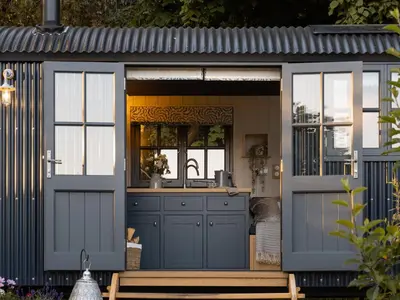 a kitchen in a shed with a sink at Moonshine in Truro