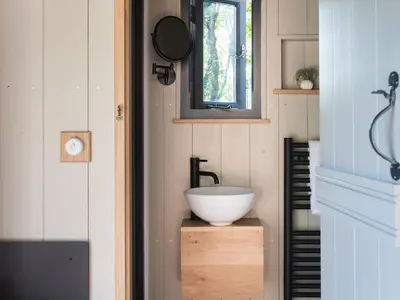 a bathroom with a bowl sink in a tiny house at Moonshine in Truro
