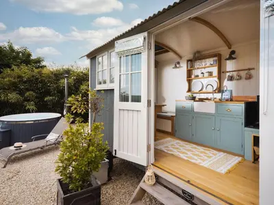an open door to a kitchen in a tiny house at Stargazer in Truro