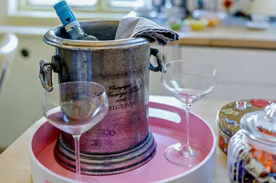 two wine glasses sitting next to a bucket of wine at 1 Bed in St. Ives oc-e28023 in St Ives
