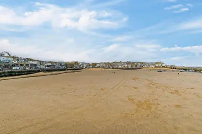 a view of a beach with houses in the background at 1 Bed in St. Ives oc-e28023 in St Ives