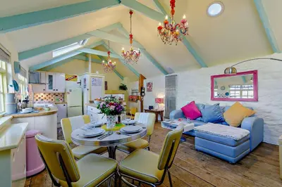 a living room with a table and a couch at 1 Bed in St. Ives oc-e28023 in St Ives