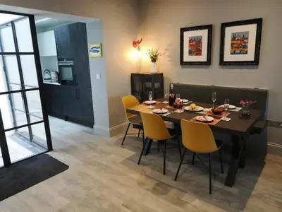 a dining room with a table and yellow chairs at 3 Bed in Fowey oc-p29280 in Fowey