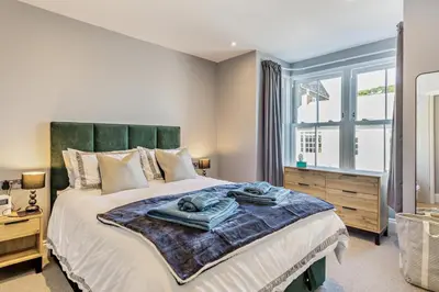 a bedroom with a large bed and a window at 3 Bed in Fowey oc-p29280 in Fowey