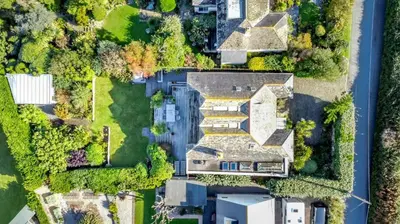 an overhead view of a house with a yard at 4 Bed in Mawgan Porth oc-h29763 in Mawgan Porth